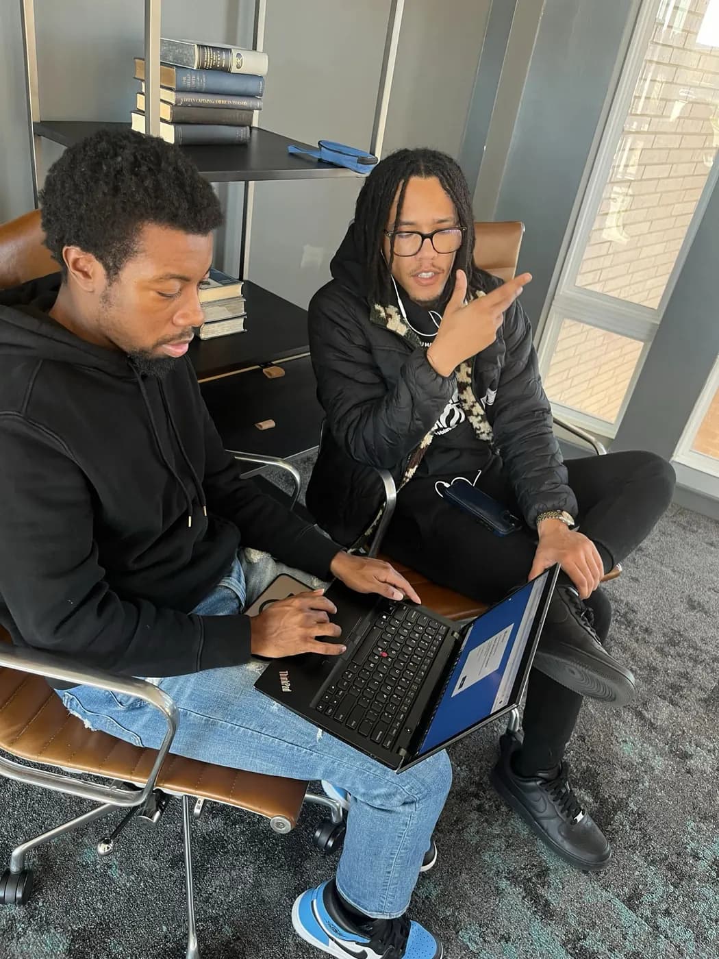 Nicholas Hawkins reviewing data with a colleague.