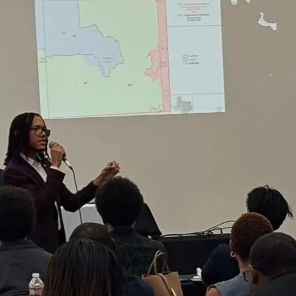 Nicholas Hawkins presenting proposed Texas redistricting maps to a North Texas audience.